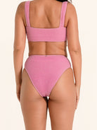 Pink thick strap bikini bottom with high waist cut and textured ribbed fabric.