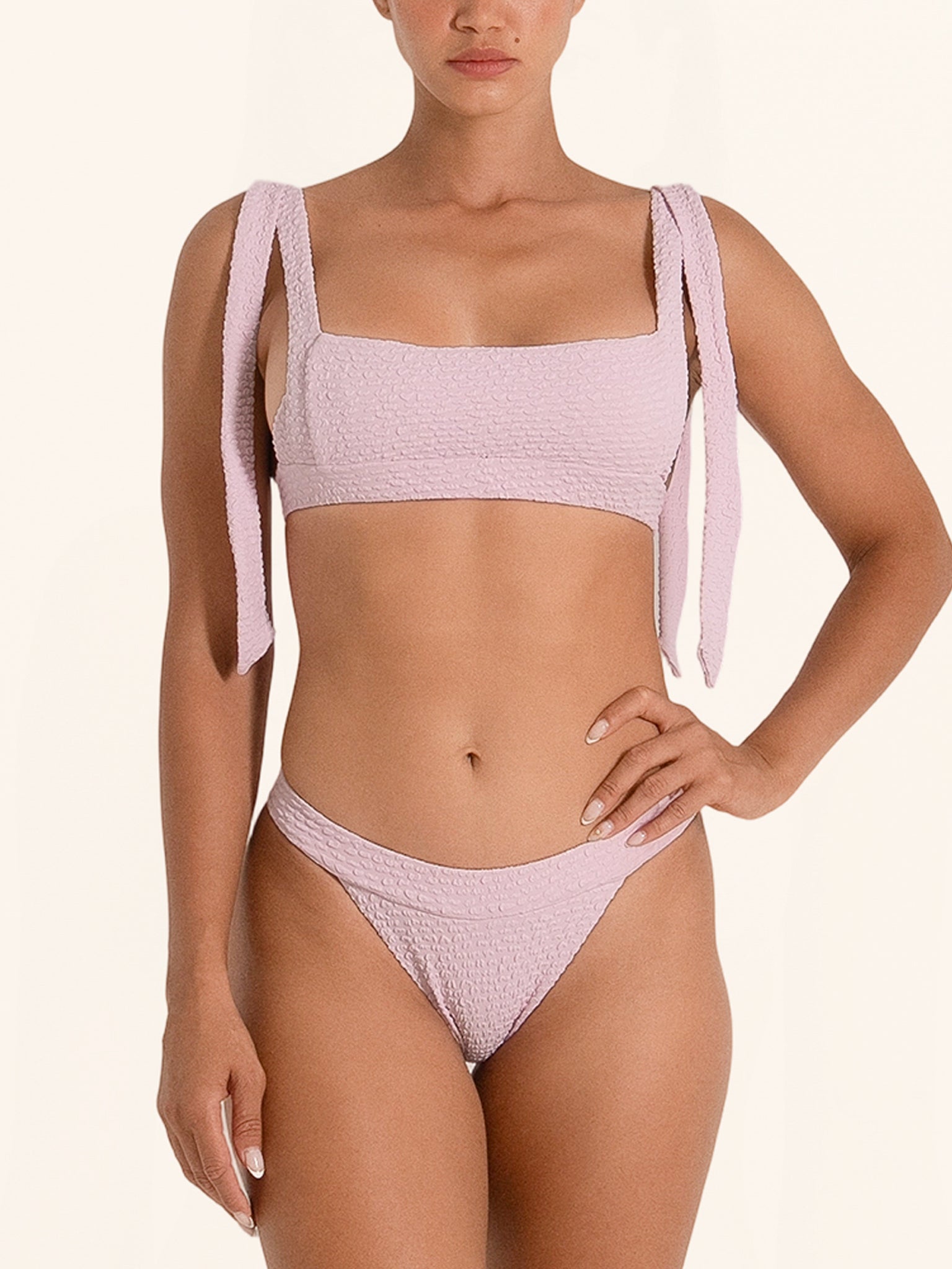 Pink V-shaped bikini bottom designed for a sleek summer look.