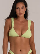 Lime green plunge bikini top with soft textured fabric and wide shoulder straps, front-facing view.