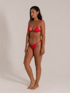 Side angle of red bikini set with barely-there straps and cheeky fit.
