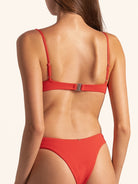 Back view of red bikini top with adjustable straps and secure clasp.
