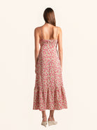 Back view of red floral midi dress with adjustable spaghetti straps