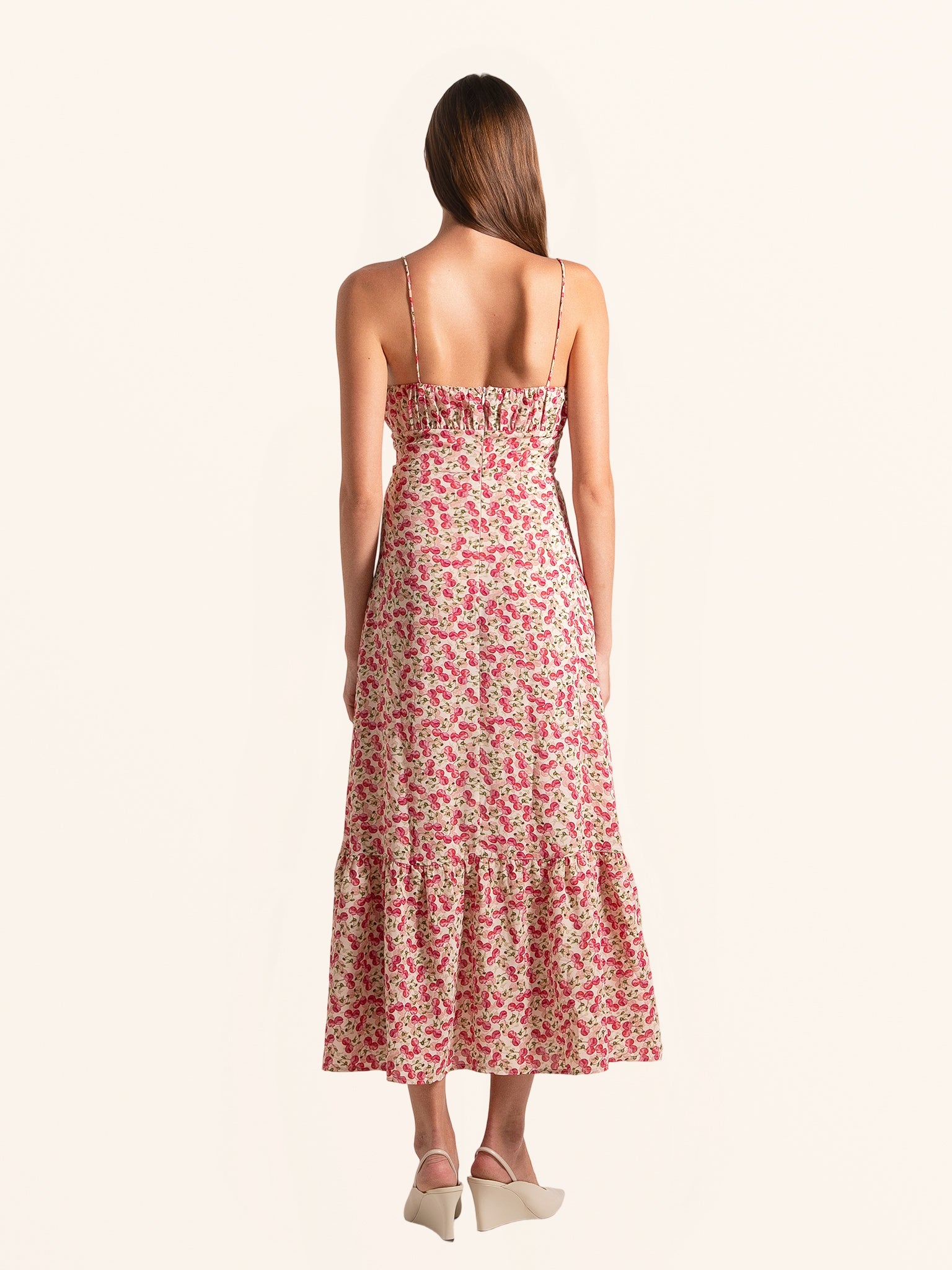 Back view of red floral midi dress with adjustable spaghetti straps