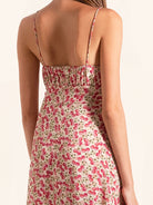 Closeup front of red floral midi dress with fitted bodice and slim straps