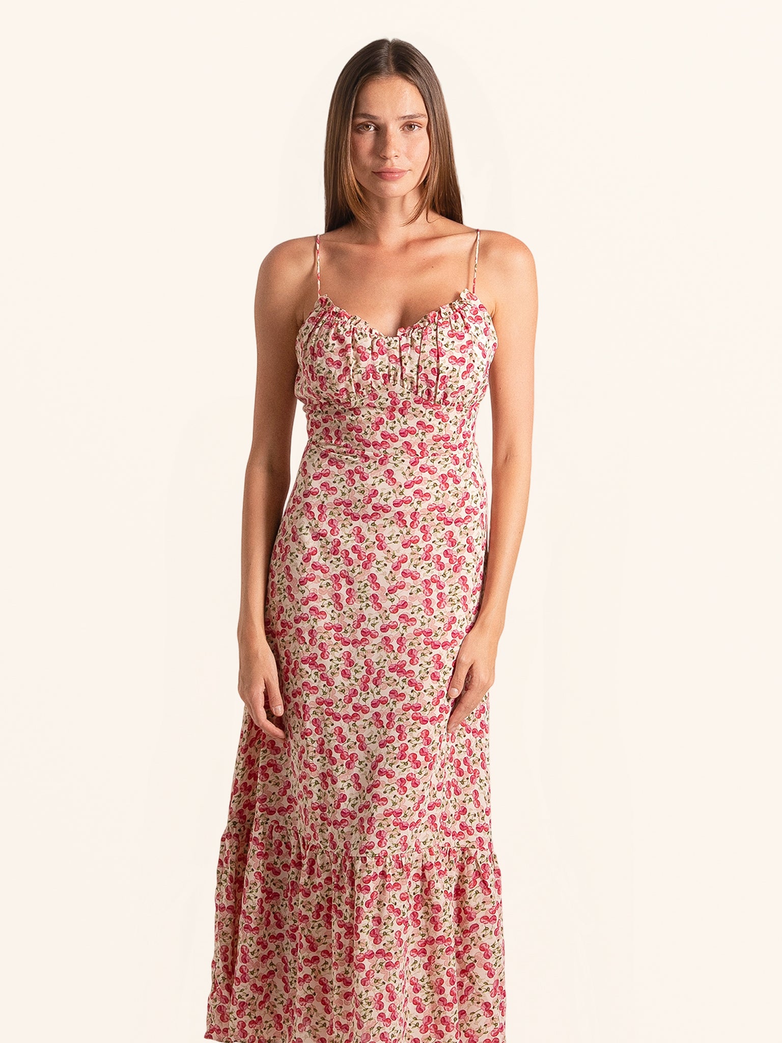 Front view of red floral spaghetti strap midi dress with ruffled hem