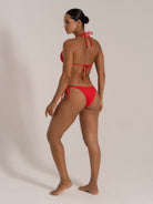 Back and side view of red tie-up halter bikini set with scrunch detail