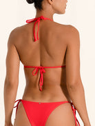 Halter style red bikini top with side ties, perfect for beachwear.