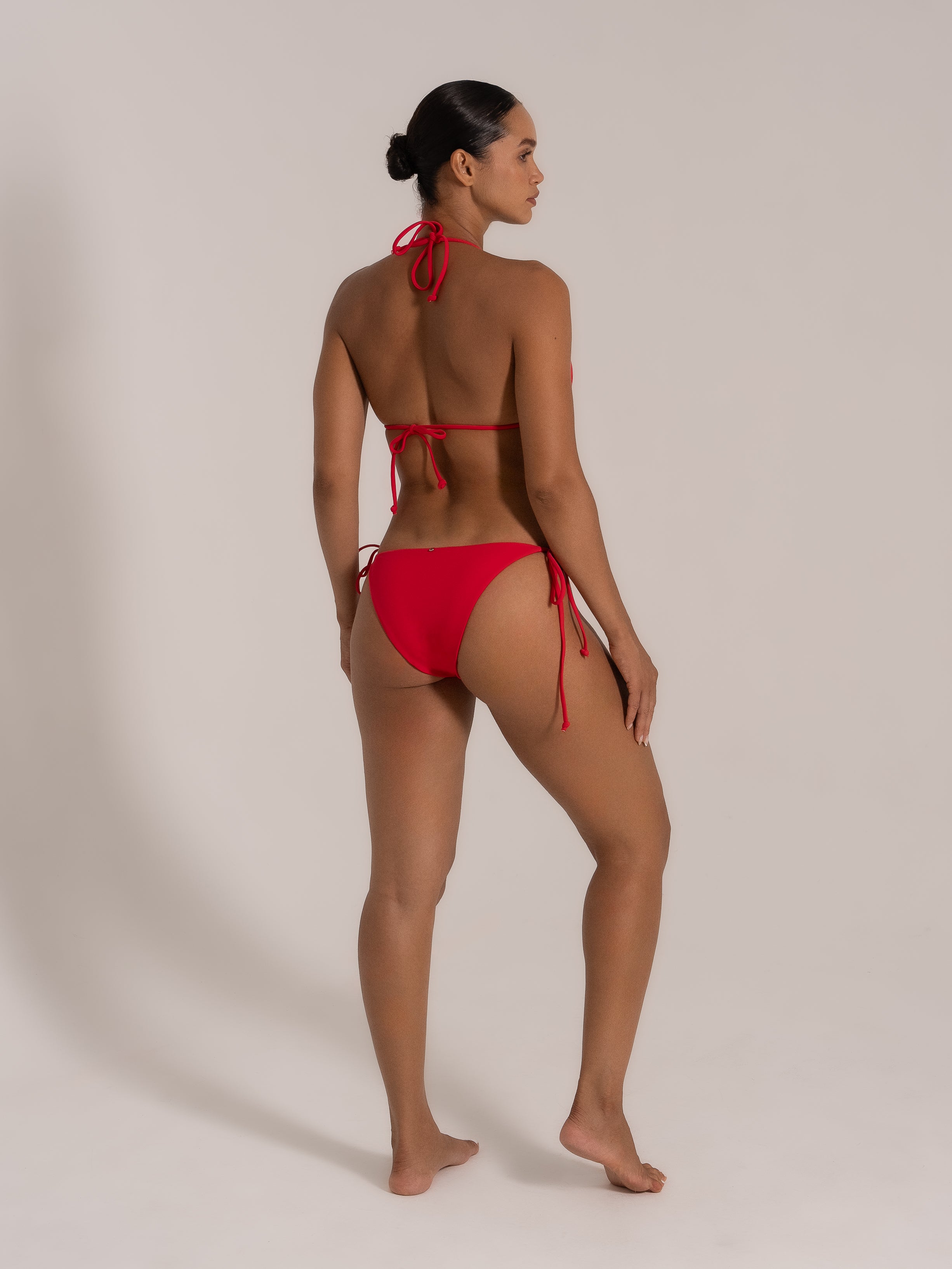 Side back view of red halter tie triangle bikini set by OCEAN MYSTERY