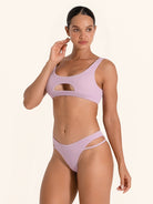 Ribbed lilac bikini bottom featuring cut-out detail.