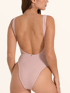 Ribbed pink one piece swimwear with high leg cut.