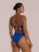 Back view of royal blue fold-over high waisted bikini bottom with adjustable spaghetti strap bikini top