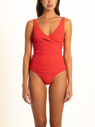 A high-quality image of the Ocean Mystery Ruby ribbed classic bikini bottoms. These versatile swim bottoms feature moderate rear coverage and seamless-feel edges for a comfortable, dig-free fit.