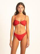 Front view of the Ruby red ribbed bikini set by Ocean Mystery, detailing the center resin ring hardware and delicate removable shoulder straps.