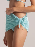 Ruched light blue bikini sarong wrap with side bow detail, perfect for beach layering.