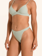 Sage green high rise bikini bottom swimwear with sculpting cut.