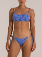 Front view of shimmer blue bikini bottom with adjustable side ties