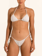 Front view of shimmer silver tie side bikini bottom with low rise fit and metallic shine.