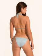 Side back angle of light blue shimmer triangle bikini set with cheeky coverage and halter ties.