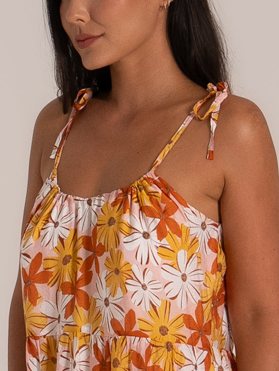 Close-up of adjustable shoulder tie straps on floral maxi dress