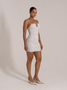 Silver sweetheart neckline mini dress with gathered sides and body-hugging fit