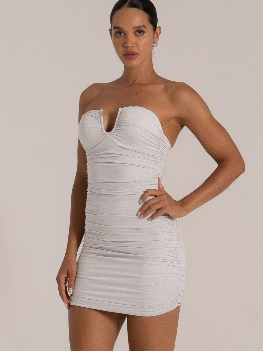 Elegant silver bodycon mini dress with ruched fabric and sweetheart front