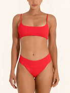 Red bikini bottom with high leg cut and flattering fit.