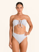 Strapless light blue bikini top featuring lace-up cutout design.