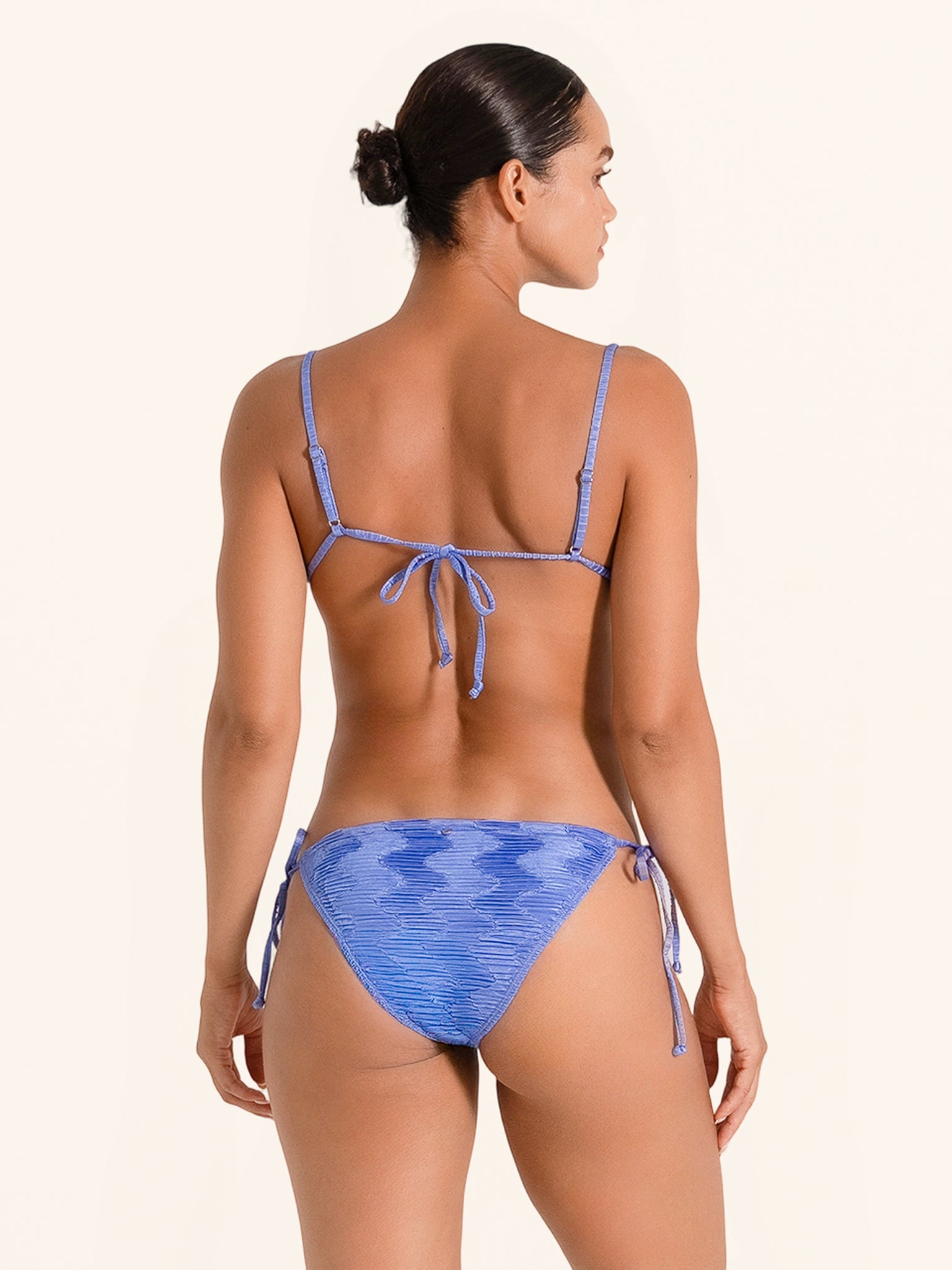 Stylish blue swimwear top with tie dye look and thin shoulder straps.