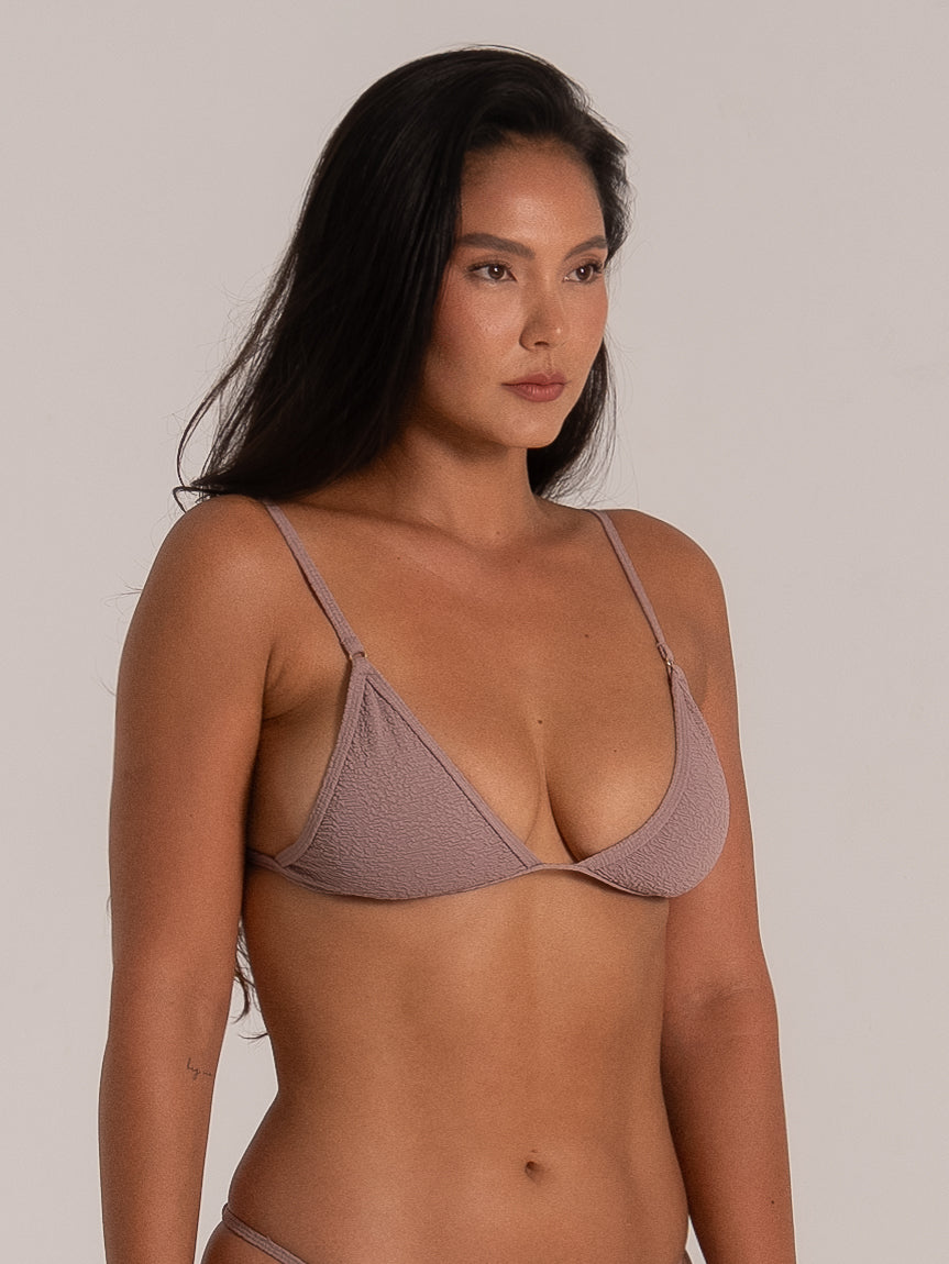 Close side detail of taupe triangle bikini top showing fabric texture and fit