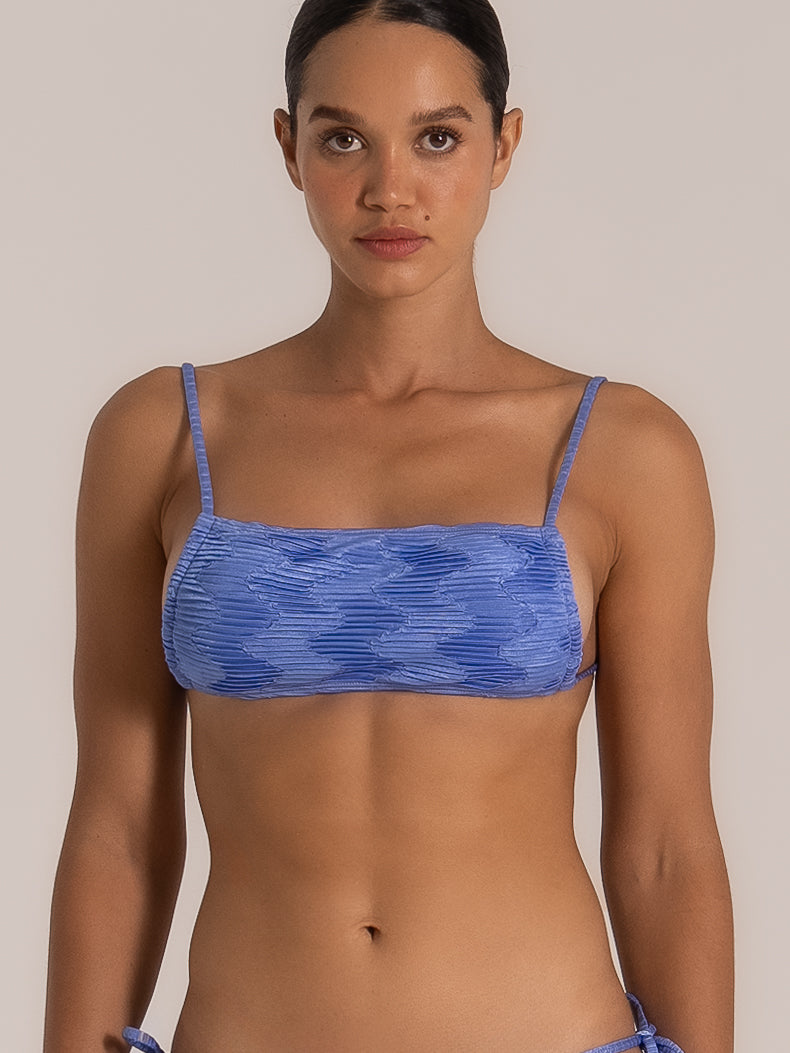 Front close-up of square neckline bikini top in textured blue fabric with soft pleated detailing