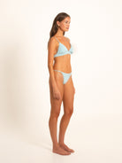 Side view of light blue V-neck bikini with adjustable straps and minimal silhouette