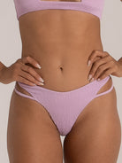 Front close-up of lilac bikini bottom in textured fabric with twin straps