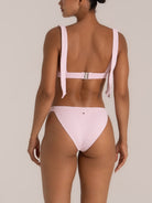 Back view of pink textured high leg bikini bottom with clean seamless fit