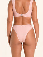 Textured pink swim bottom with flattering ring style design.