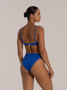 Back clasp view of textured royal blue bikini top with adjustable straps