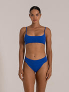 Front view of textured royal blue bikini top with spaghetti straps