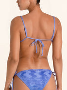 Tie dye blue bikini top with straight neckline and chic design.