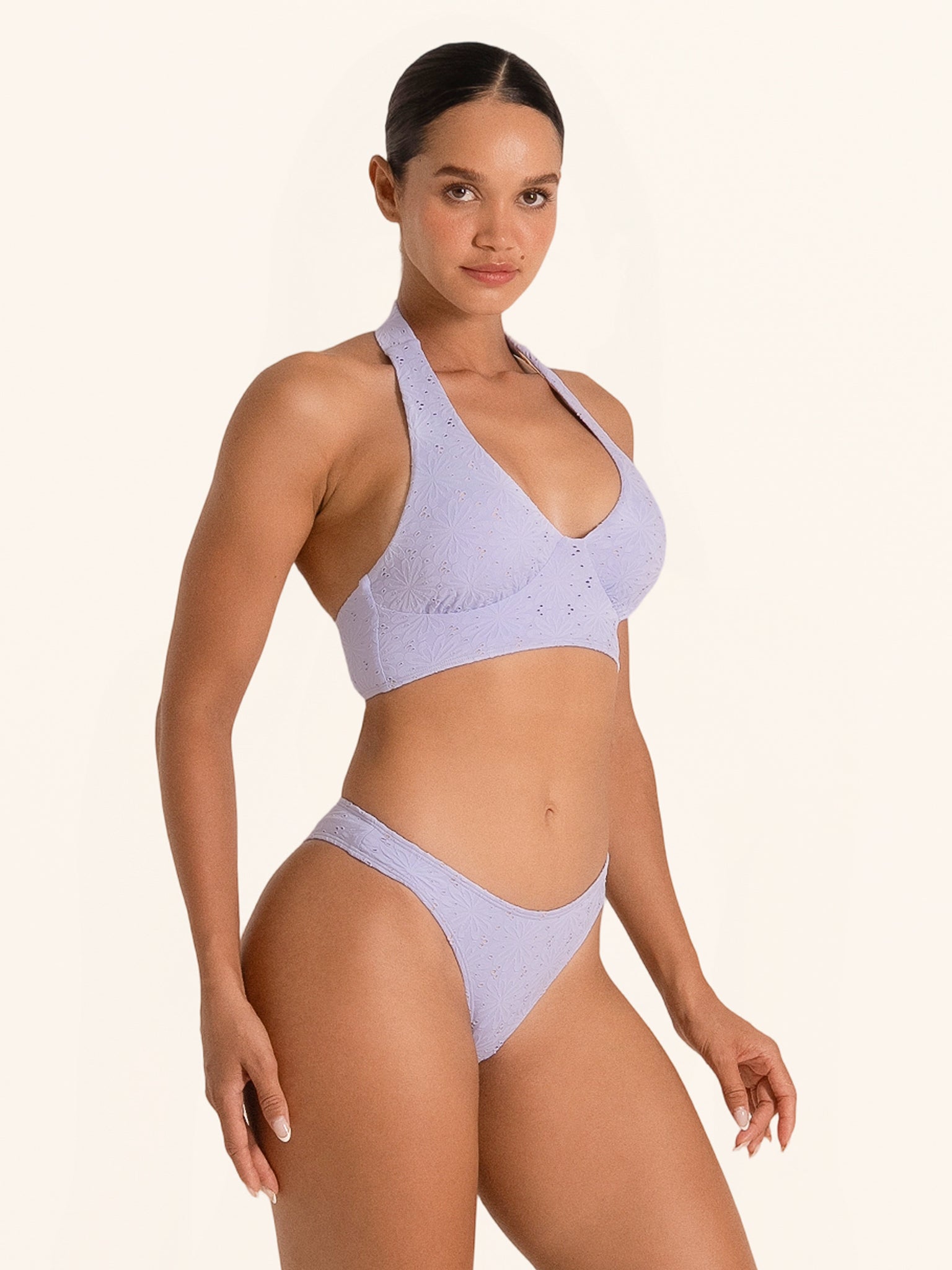 Trendy lilac swimwear bikini top with cutout front design.