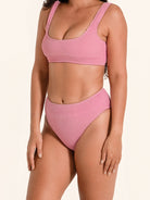 Trendy pink bikini bottom with thick strap sides and sculpting high waist fit.