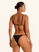 Back angle of black triangle bikini top with slim straps and open back fit.