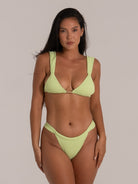 Close-up front view of lime green bikini top with a V neckline and thick supportive straps.