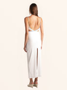 Rear view of white cut out maxi dress with back slit