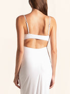 Rear closeup of white midi dress showing back strap cut out
