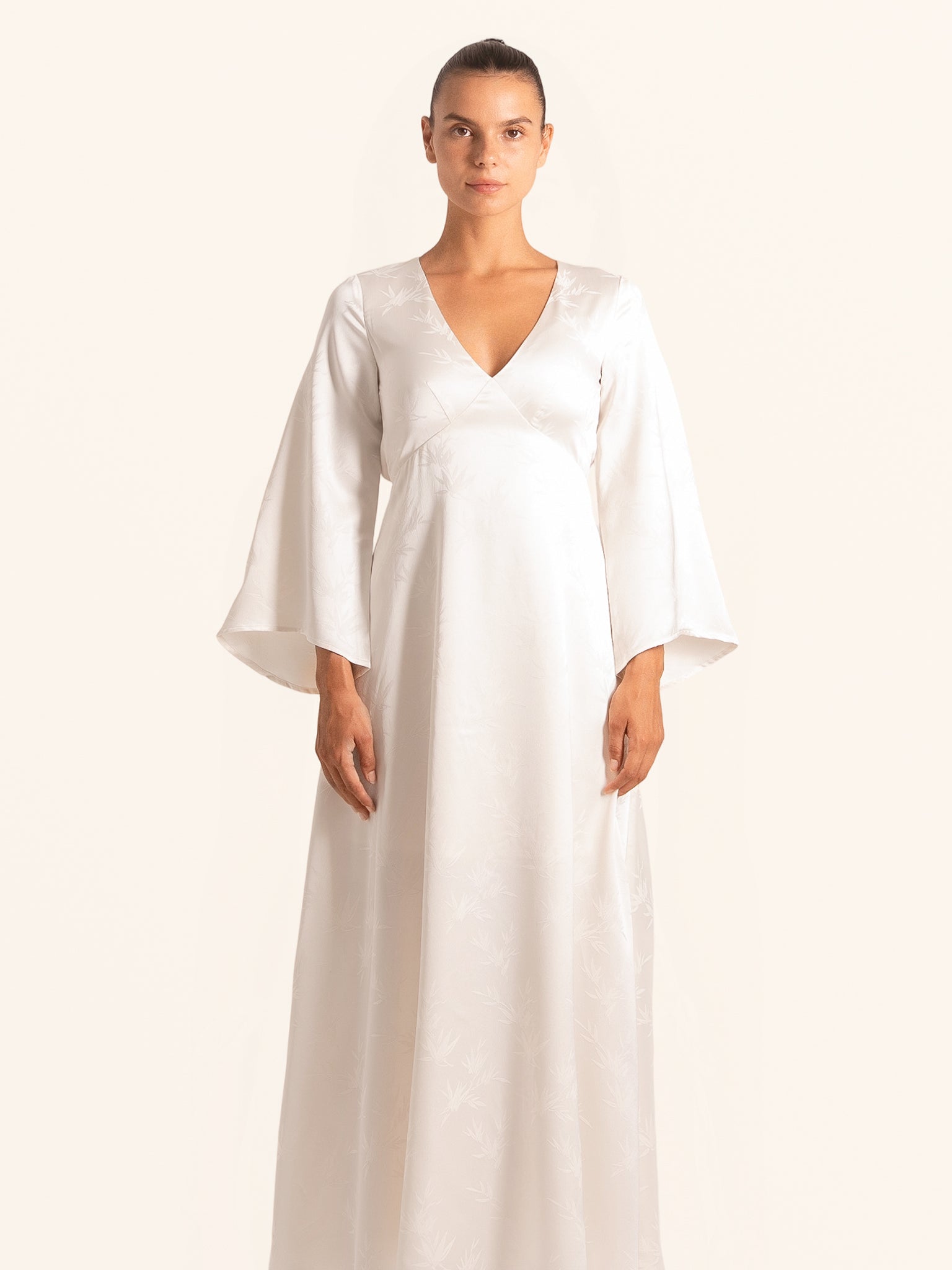 Front view of white long sleeve maxi dress with V neckline