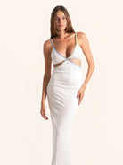 Woman wearing white cut out maxi dress full length view