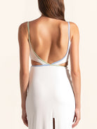 Back view of white maxi dress with open back cut out