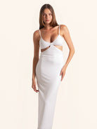 Woman in white midi dress with cut out detail full body front