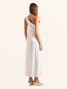Back side angle of white one shoulder midi dress with draped style