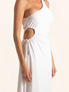 Closeup detail of side cutout on white one shoulder midi dress