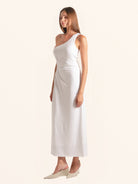 Side angle of white one shoulder midi dress with elegant fit